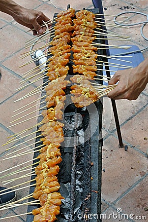 Malaysia Chicken Satay Cooking on a Hot Charcoal Grill Stock Photo